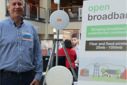 Alan with the Open broadband banner
