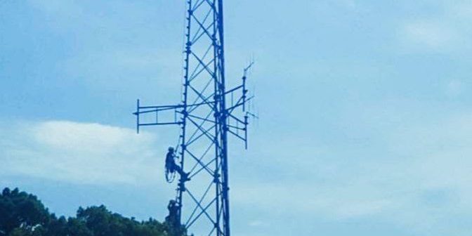 Workers fixing issue on the tower