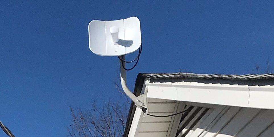 Dish with 3 panels attached to white house